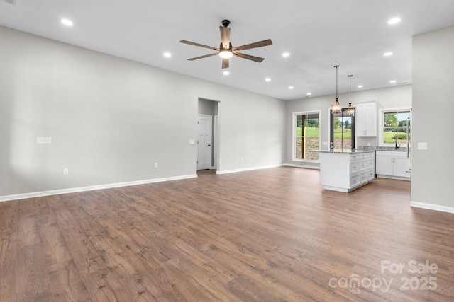3981 Zero Mull Rd, Morganton, NC 28655 - unfurnished living room with recessed lighting, ceiling fan, and dark wood-style flooring