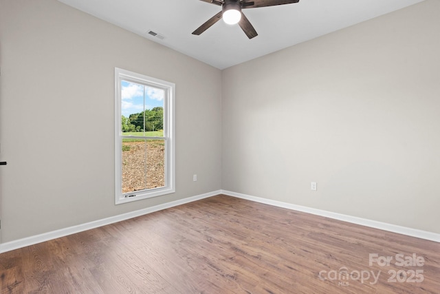 3981 Zero Mull Rd, Morganton, NC 28655 - empty room with a ceiling fan and wood finished floors