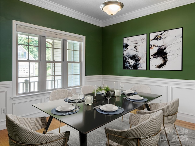 19 Driftstone Cir, Arden, NC 28704 - dining space featuring a decorative wall, wood finished floors, crown molding, and wainscoting
