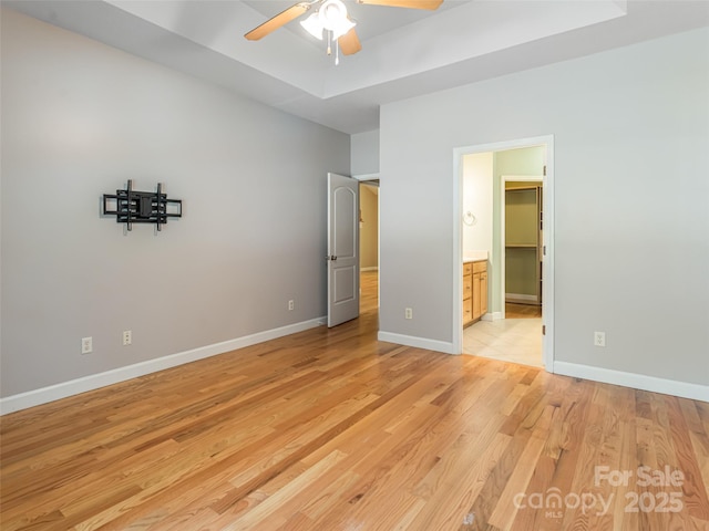 19 Driftstone Cir, Arden, NC 28704 - unfurnished bedroom with light wood-style floors, ensuite bathroom, and a ceiling fan