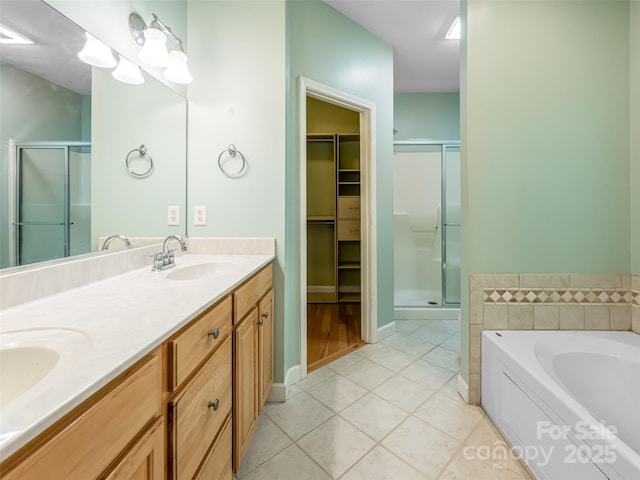 19 Driftstone Cir, Arden, NC 28704 - full bath featuring a shower stall, a spacious closet, double vanity, and a bath