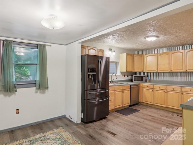 32 Saunooke Rd, Asheville, NC 28805 - kitchen with stainless steel appliances, light brown cabinets, and light wood-type flooring