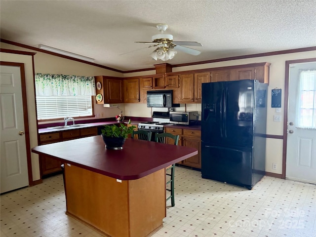 5816 Scotland Yard Rd, Rock Hill, SC 29732 - kitchen with black appliances, plenty of natural light, a kitchen island, ceiling fan, and a textured ceiling