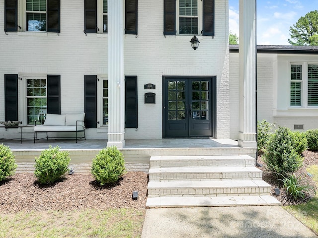 3001 Colony Rd, Charlotte, NC 28211 - entrance to property with covered porch, brick siding, and french doors