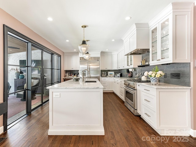 3001 Colony Rd, Charlotte, NC 28211 - kitchen with premium appliances, tasteful backsplash, white cabinets, light stone countertops, and recessed lighting