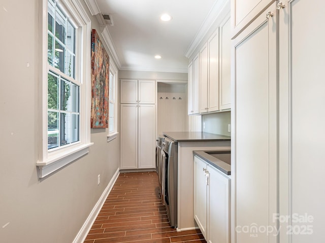3001 Colony Rd, Charlotte, NC 28211 - laundry room with cabinet space, washer and clothes dryer, crown molding, dark wood-style floors, and recessed lighting