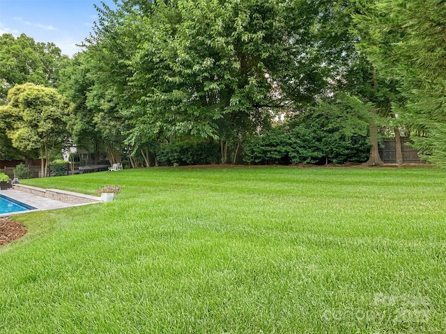 3001 Colony Rd, Charlotte, NC 28211 - view of grassy yard with an outdoor pool