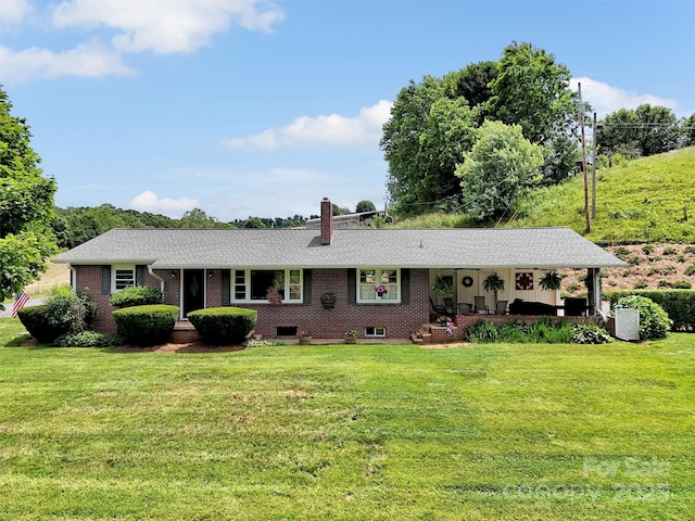 463 Golf Course Rd, Clyde, NC 28721 - ranch-style house featuring a front lawn, brick siding, and a chimney