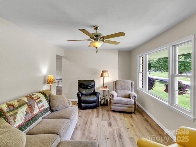 463 Golf Course Rd, Clyde, NC 28721 - living room featuring light wood-type flooring and ceiling fan