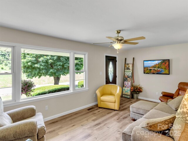 463 Golf Course Rd, Clyde, NC 28721 - living room featuring a ceiling fan and light wood finished floors