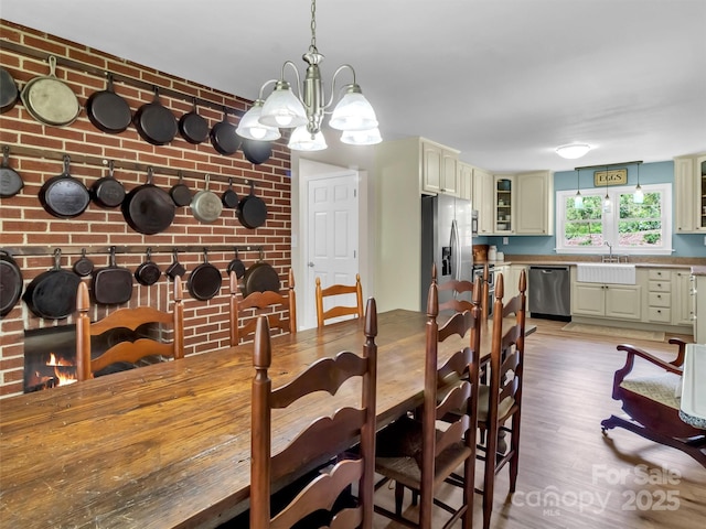 463 Golf Course Rd, Clyde, NC 28721 - dining area featuring light wood-type flooring and a chandelier