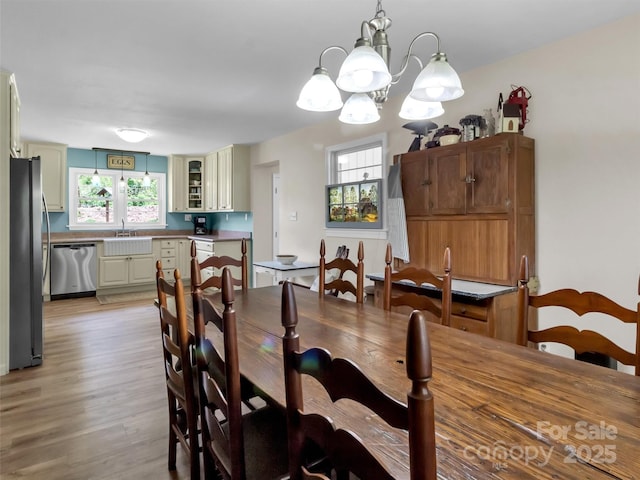 463 Golf Course Rd, Clyde, NC 28721 - dining space with a chandelier and light wood-style flooring