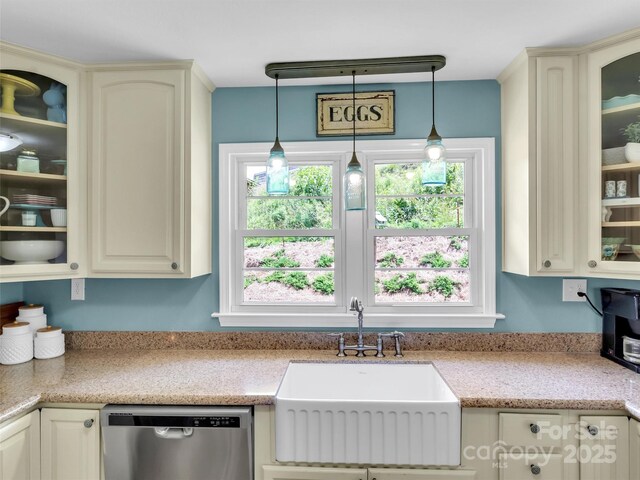 463 Golf Course Rd, Clyde, NC 28721 - kitchen with stainless steel dishwasher, cream cabinets, plenty of natural light, and glass insert cabinets