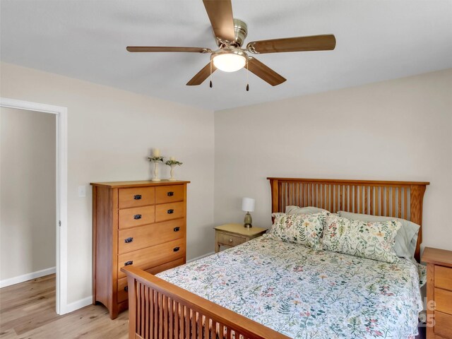 463 Golf Course Rd, Clyde, NC 28721 - bedroom with light wood-style floors and ceiling fan
