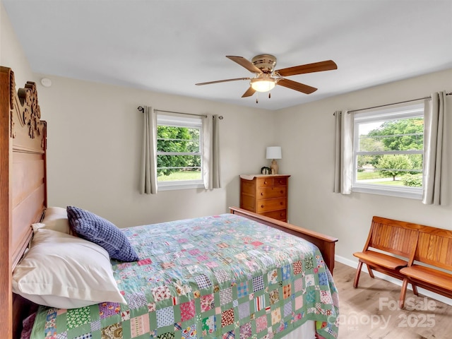 463 Golf Course Rd, Clyde, NC 28721 - bedroom featuring light wood finished floors and ceiling fan