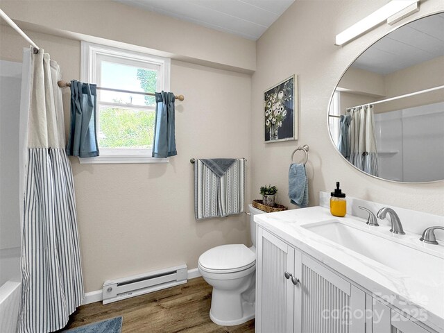 463 Golf Course Rd, Clyde, NC 28721 - full bath with a baseboard heating unit, vanity, wood finished floors, and shower / bath combo