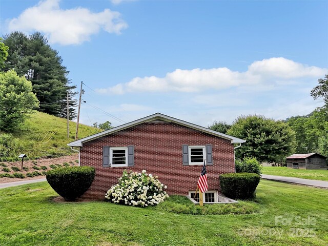 463 Golf Course Rd, Clyde, NC 28721 - view of side of property featuring a yard and brick siding