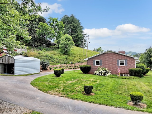 463 Golf Course Rd, Clyde, NC 28721 - view of green lawn with asphalt driveway