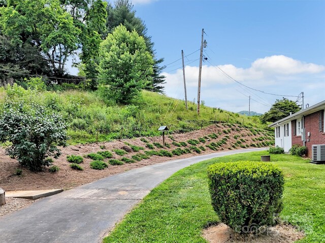 463 Golf Course Rd, Clyde, NC 28721 - surrounding community with a lawn
