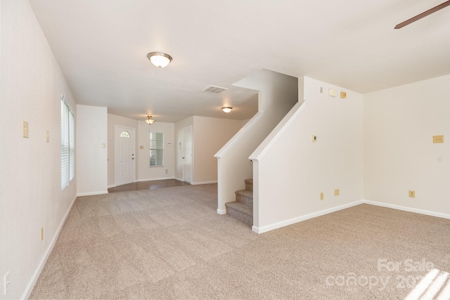 1432 Matthew Allen Cir, Kannapolis, NC 28081 - unfurnished living room with light carpet, ceiling fan, and stairs