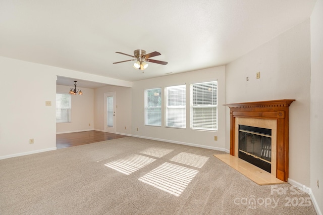 1432 Matthew Allen Cir, Kannapolis, NC 28081 - unfurnished living room featuring carpet, a fireplace, a chandelier, and ceiling fan