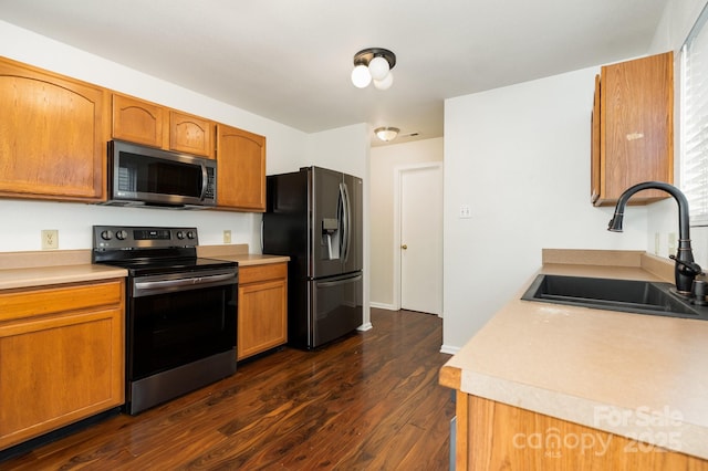 1432 Matthew Allen Cir, Kannapolis, NC 28081 - kitchen featuring appliances with stainless steel finishes, dark wood finished floors, light countertops, and brown cabinetry