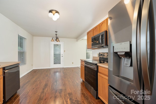 1432 Matthew Allen Cir, Kannapolis, NC 28081 - kitchen featuring appliances with stainless steel finishes, dark wood-style flooring, light countertops, and pendant lighting
