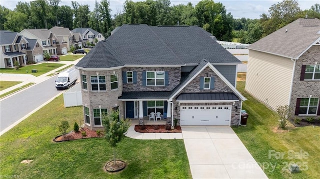 2110 Owls View Ln, Colfax, NC 27235 - view of front facade with driveway, stone siding, a garage, and a front lawn