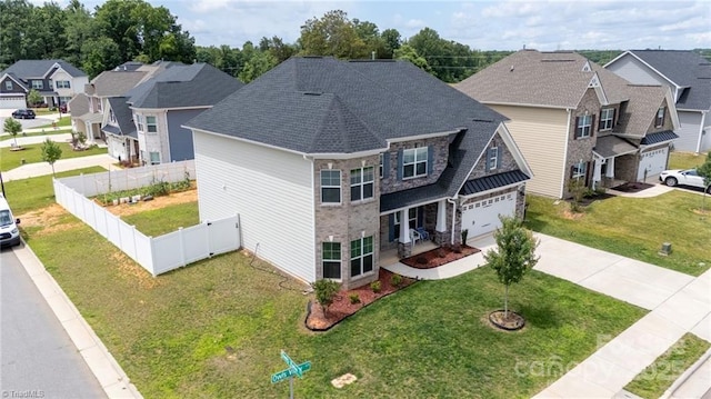 2110 Owls View Ln, Colfax, NC 27235 - view of front facade featuring driveway, a residential view, an attached garage, stone siding, and a shingled roof