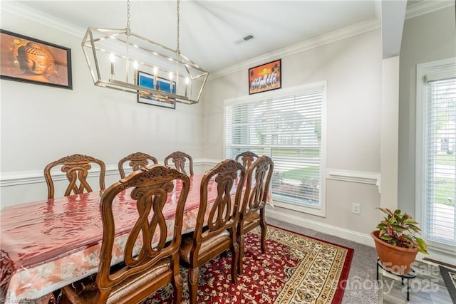 2110 Owls View Ln, Colfax, NC 27235 - carpeted dining area with a chandelier and crown molding