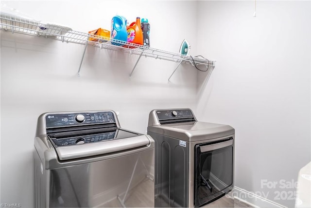 2110 Owls View Ln, Colfax, NC 27235 - laundry area with washing machine and clothes dryer and baseboards
