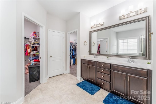 2110 Owls View Ln, Colfax, NC 27235 - bathroom with double vanity and a walk in closet