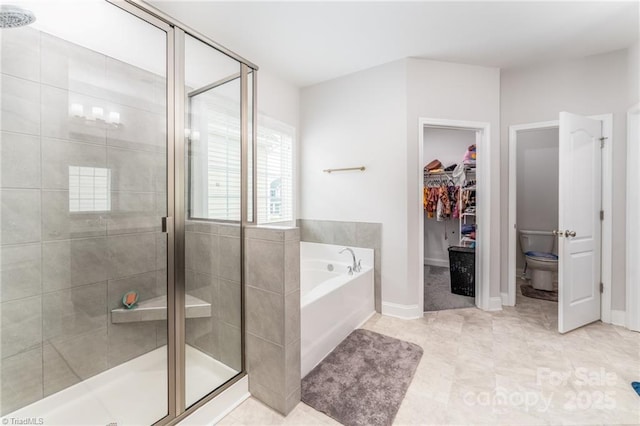 2110 Owls View Ln, Colfax, NC 27235 - full bath featuring a bath, a stall shower, and a spacious closet