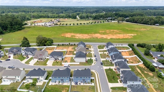 2110 Owls View Ln, Colfax, NC 27235 - aerial view of property and surrounding area featuring a forest and nearby suburban area