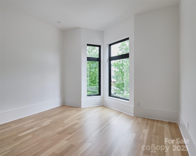 1511 Waverly Ave, Charlotte, NC 28203 - unfurnished room featuring light wood-style flooring and baseboards