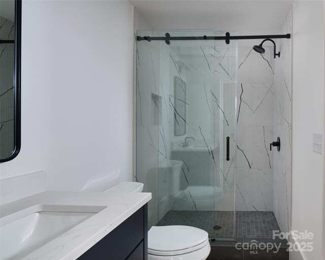 1511 Waverly Ave, Charlotte, NC 28203 - bathroom featuring vanity and a marble finish shower