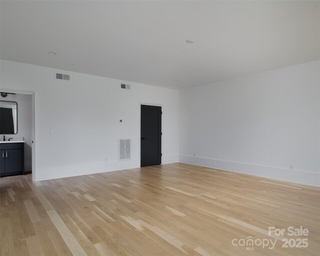 1511 Waverly Ave, Charlotte, NC 28203 - unfurnished room with light wood-style flooring and baseboards