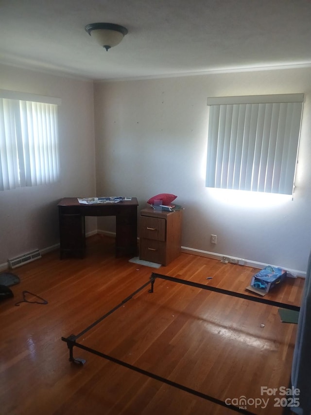 2815 Highland Dr, Lincolnton, NC 28092 - unfurnished bedroom featuring wood finished floors and baseboards