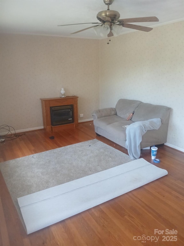 2815 Highland Dr, Lincolnton, NC 28092 - living area with wood finished floors, ceiling fan, and a fireplace