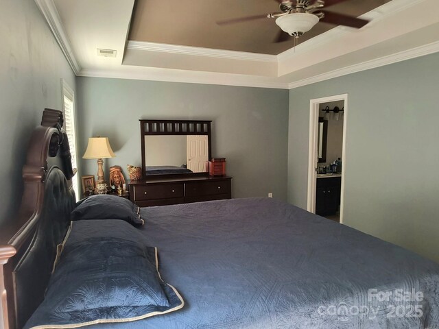 10825 Traders Ct, Davidson, NC 28036 - bedroom featuring a tray ceiling, ornamental molding, ceiling fan, and ensuite bath