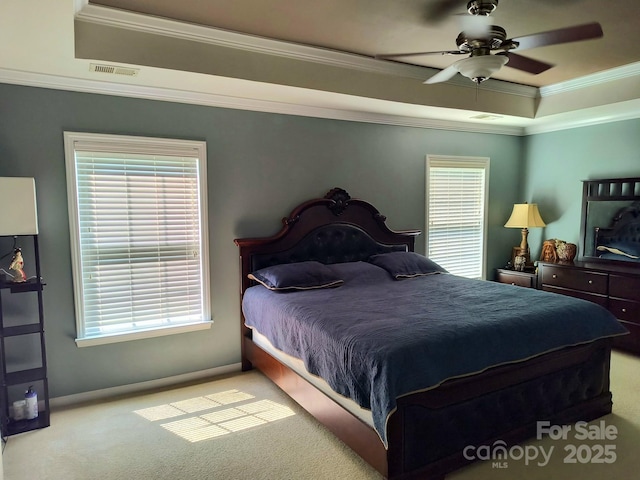10825 Traders Ct, Davidson, NC 28036 - carpeted bedroom with a tray ceiling, crown molding, multiple windows, and a ceiling fan