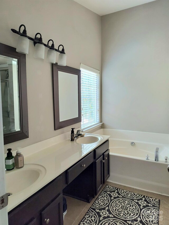 10825 Traders Ct, Davidson, NC 28036 - bathroom featuring a bath, double vanity, and tile patterned flooring