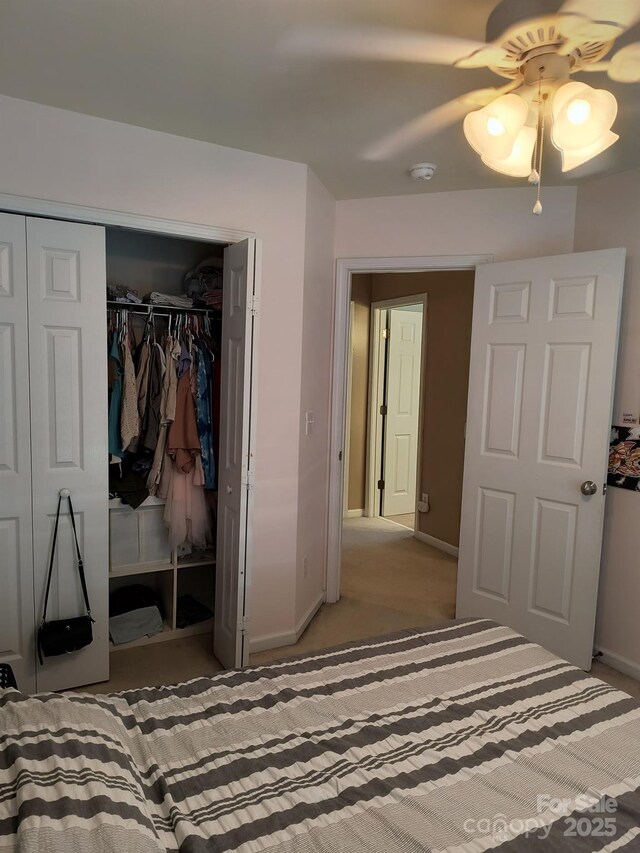 10825 Traders Ct, Davidson, NC 28036 - carpeted bedroom with a closet and a ceiling fan