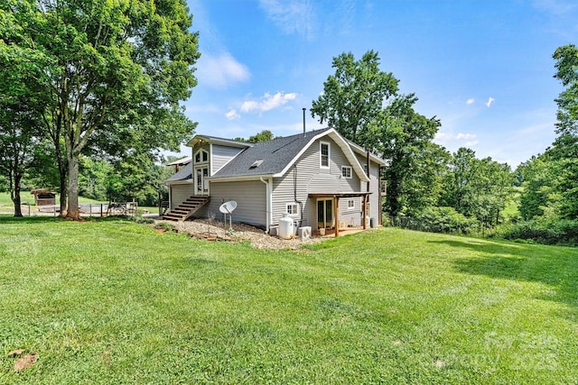 3724 County Home Rd, Conover, NC 28613 - view of home's exterior featuring a yard, roof with shingles, and stairs