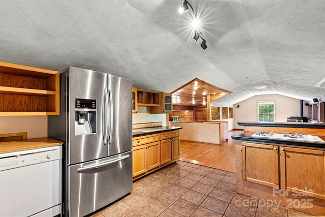 3724 County Home Rd, Conover, NC 28613 - kitchen featuring white appliances, open shelves, vaulted ceiling, light tile patterned floors, and dark countertops