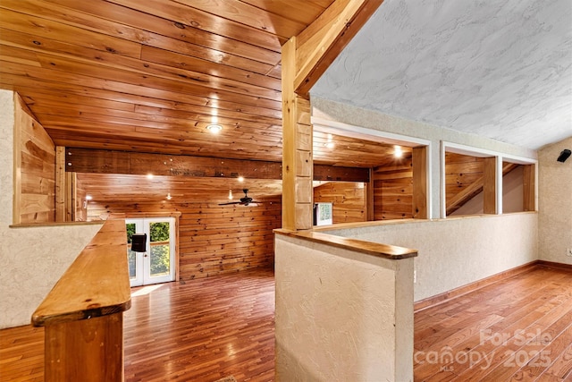 3724 County Home Rd, Conover, NC 28613 - bar area with wood-type flooring, a textured wall, wood walls, and a ceiling fan