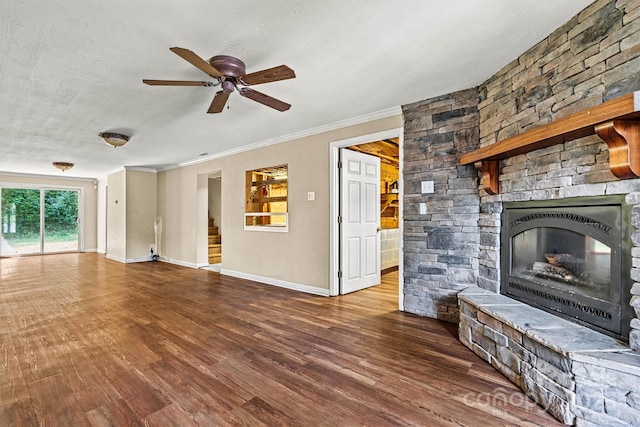 3724 County Home Rd, Conover, NC 28613 - unfurnished living room with a stone fireplace, ceiling fan, wood finished floors, ornamental molding, and stairway