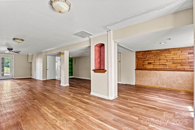 3724 County Home Rd, Conover, NC 28613 - unfurnished living room with wood finished floors, ornamental molding, and a ceiling fan