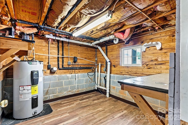 3724 County Home Rd, Conover, NC 28613 - basement featuring water heater, wooden walls, and wood finished floors