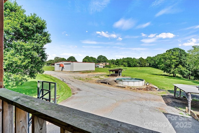 3724 County Home Rd, Conover, NC 28613 - view of grassy yard with an outdoor structure, a garage, and driveway